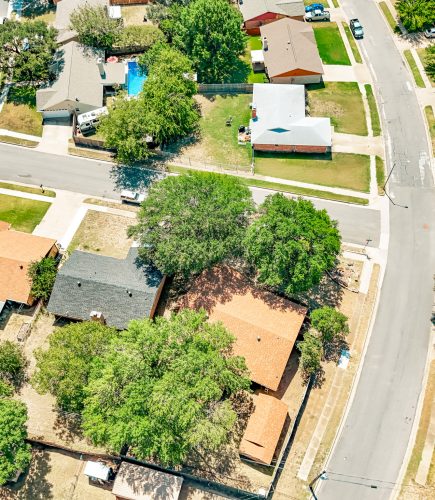 Curved neighborhood street reconstructed by Reliable Paving in Burleson, TX.
