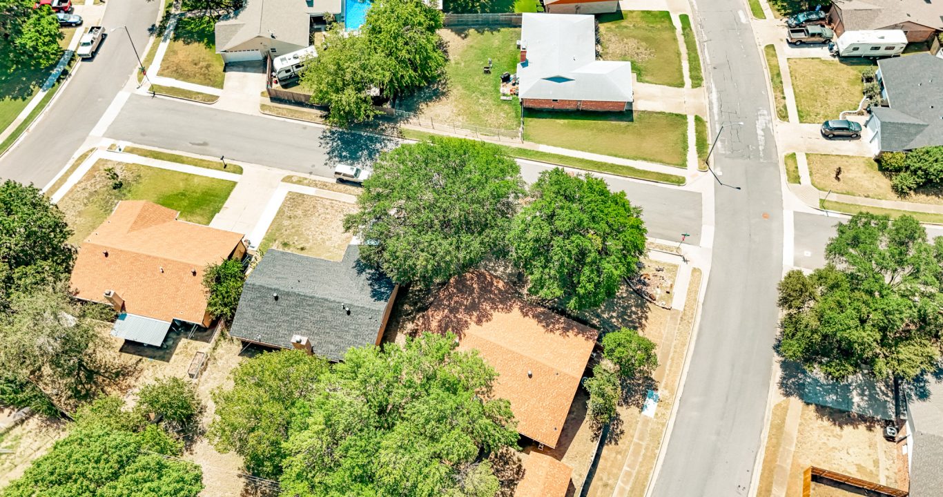 Curved neighborhood street reconstructed by Reliable Paving in Burleson, TX.