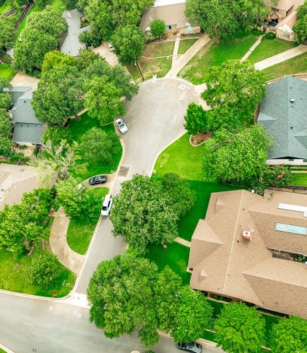 Freshly paved residential street in Colleyville, TX after rehabilitation by Reliable Paving, Inc.