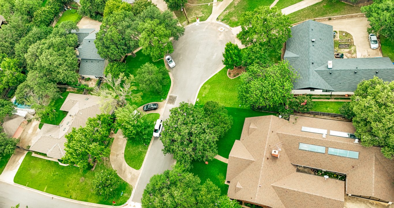 Freshly paved residential street in Colleyville, TX after rehabilitation by Reliable Paving, Inc.
